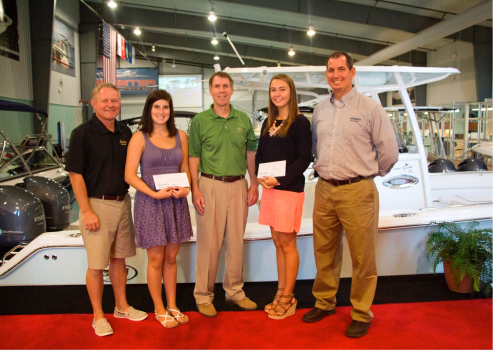 Destin and Fort Walton Beach winners of the Legendary Marine Scholarship Awards included Blythe Greene, left and Kerri Andre, right, with Destin Sales Manager Bob Peavler, far left; Legendary Marine Managing Partner Fred Pace, center; and Fort Walton Beach Sales Manager Jeff Henley, far right.